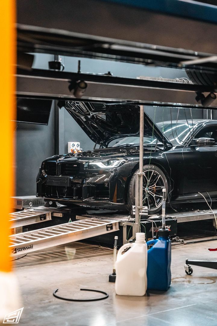 Black BMW M2 strapped to the dyno at CADE Technologies