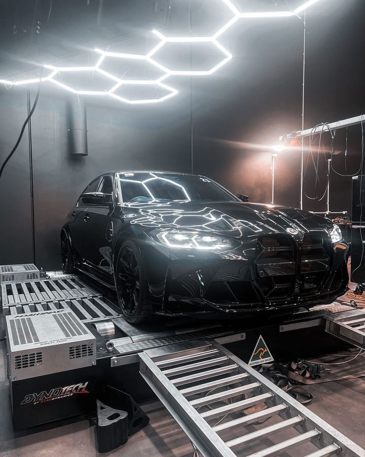 Black BMW M4 (G82) on the Dynotech AWD dyno at CADE Technologies