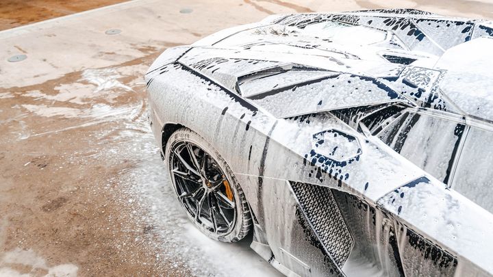 Lamborghini Aventador covered in snow foam during a detail wash