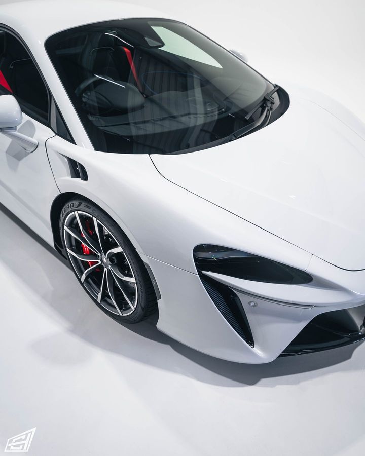 White McLaren Artura, front three-quarter detail against a white backdrop