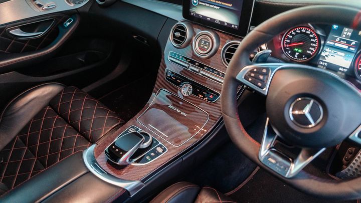 Mercedes-AMG interior with diamond-stitched leather seats, carbon trim and AMG steering wheel