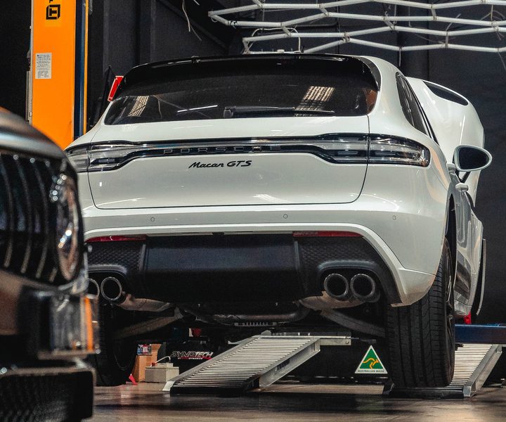 White Porsche Macan GTS (95B) on the dyno, seen from the rear
