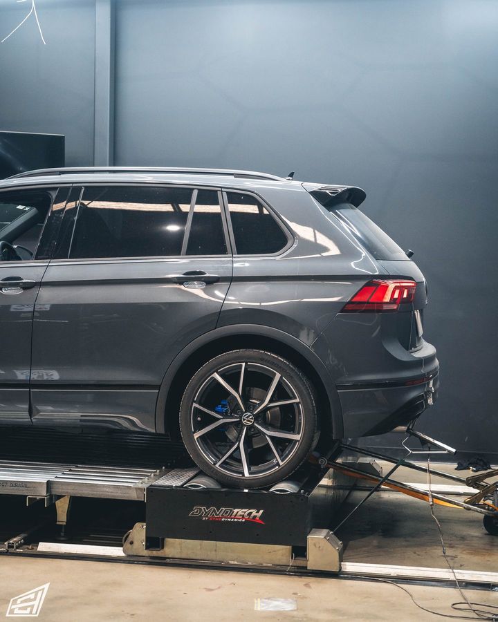 Grey Volkswagen SUV on the dyno, rear three-quarter view