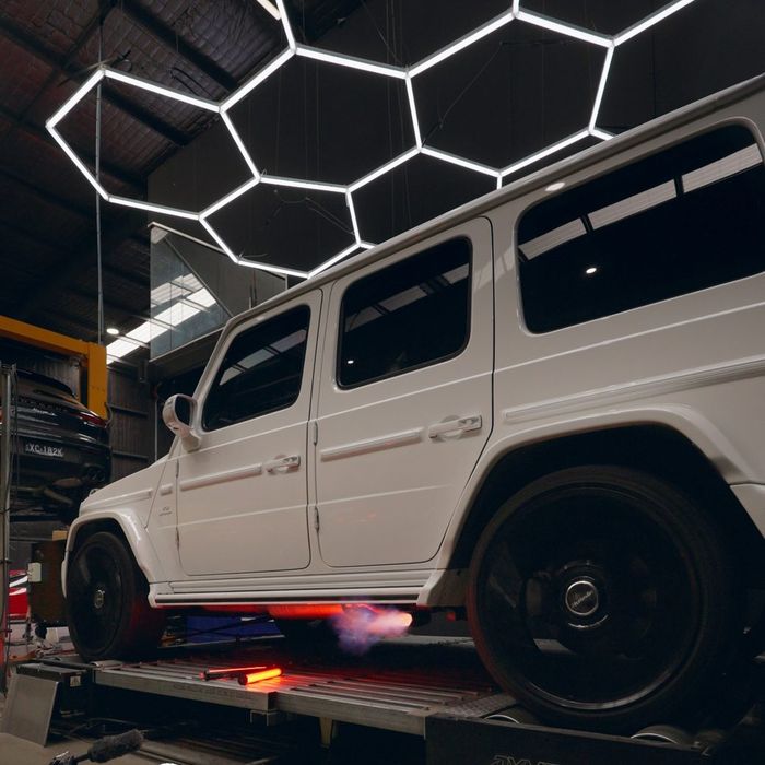 White Mercedes-AMG G63 with flames under the rear on the CADE dyno
